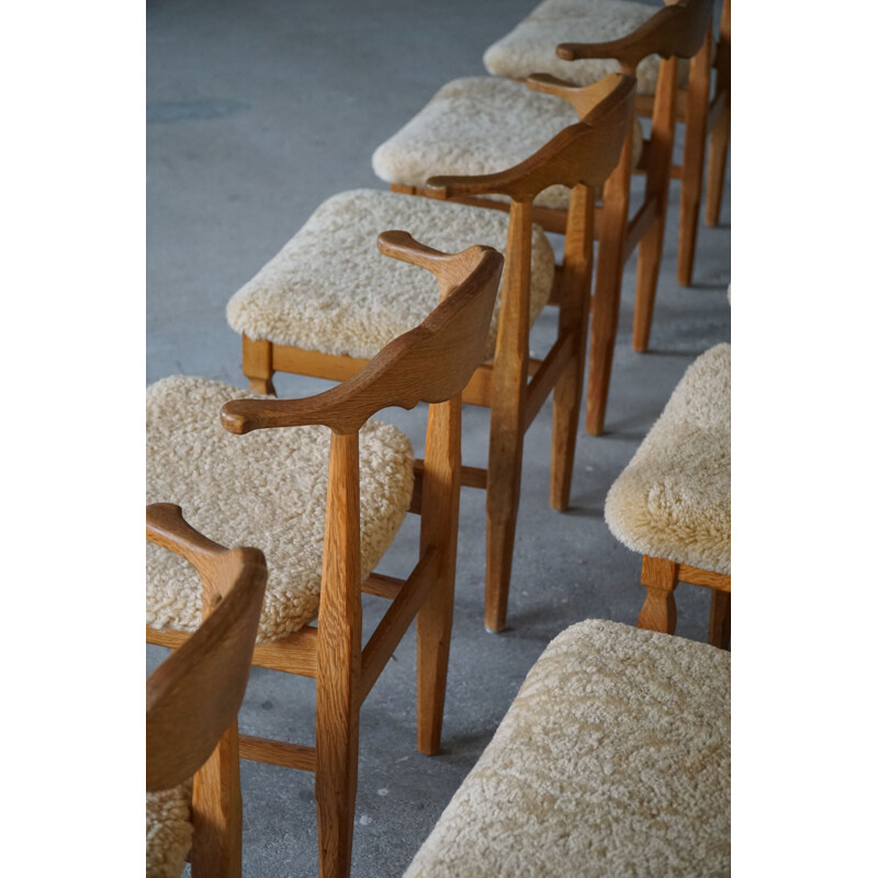 Set of 10 vintage dining chairs in oakwood and reupholstered in lambswool by Henning Kjærnulf, 1960s