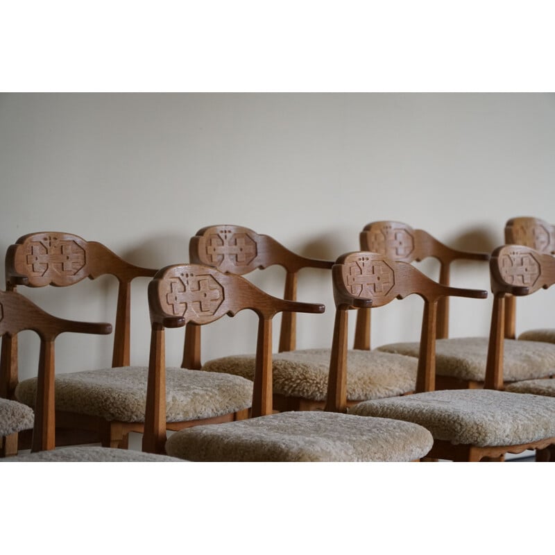 Set of 10 vintage dining chairs in oakwood and reupholstered in lambswool by Henning Kjærnulf, 1960s