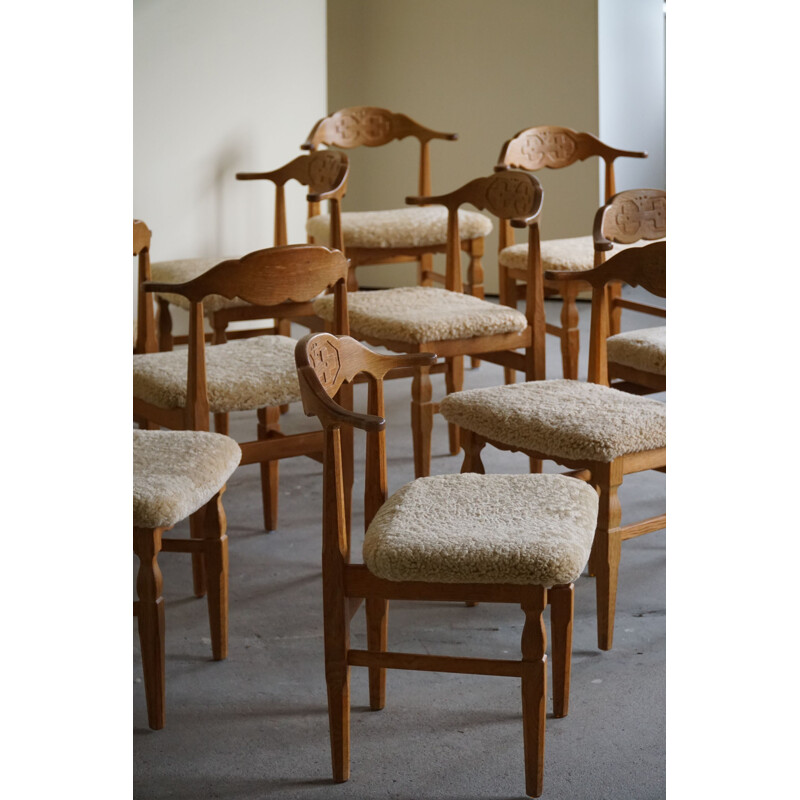 Set of 10 vintage dining chairs in oakwood and reupholstered in lambswool by Henning Kjærnulf, 1960s