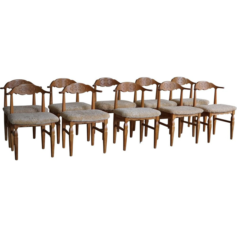 Set of 10 vintage dining chairs in oakwood and reupholstered in lambswool by Henning Kjærnulf, 1960s