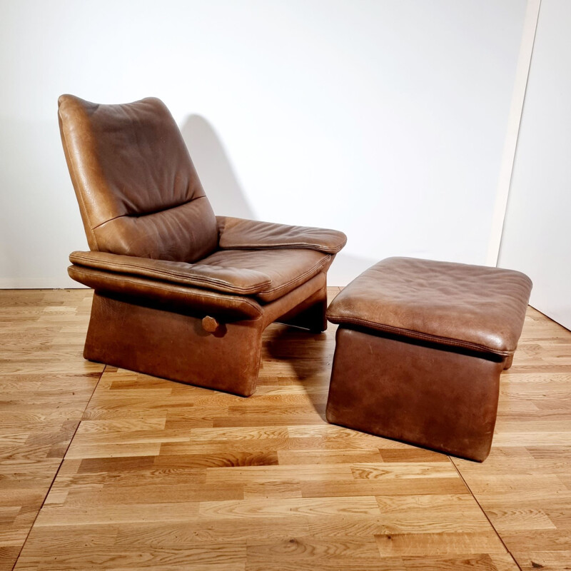 Vintage brown leather armchair and ottoman by Hans Kaufeld, 1970-1980