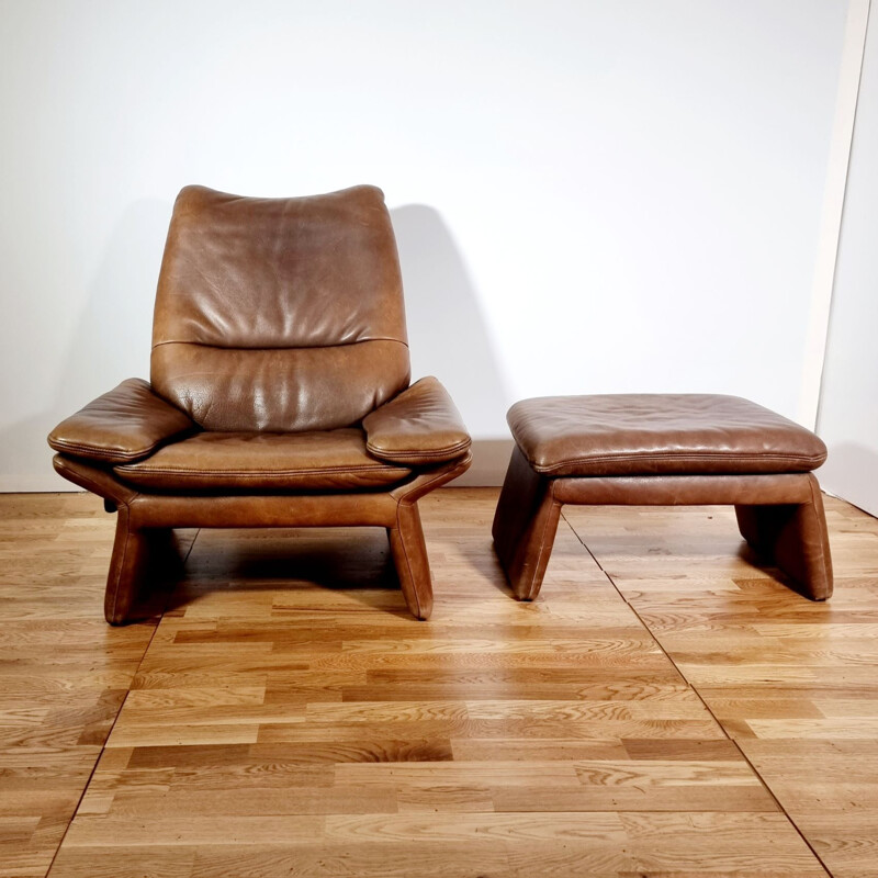 Vintage brown leather armchair and ottoman by Hans Kaufeld, 1970-1980