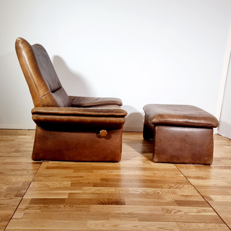 Vintage brown leather armchair and ottoman by Hans Kaufeld, 1970-1980