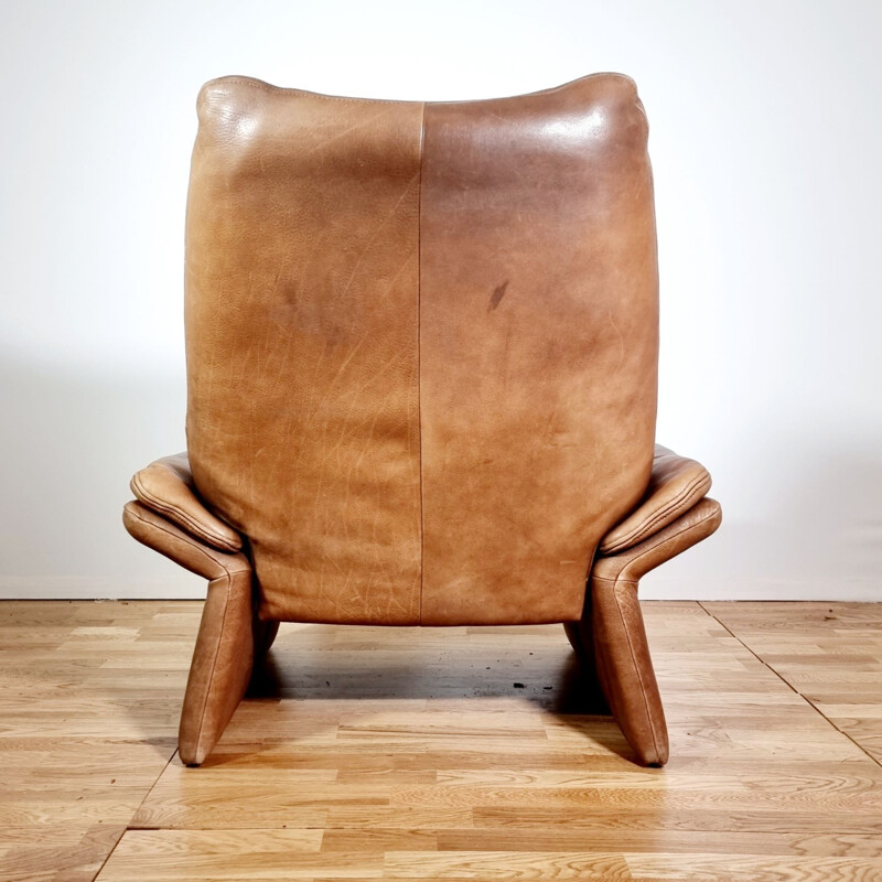 Vintage brown leather armchair and ottoman by Hans Kaufeld, 1970-1980