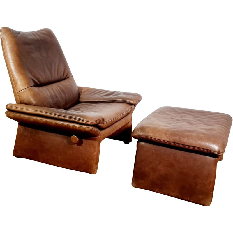 Vintage brown leather armchair and ottoman by Hans Kaufeld, 1970-1980