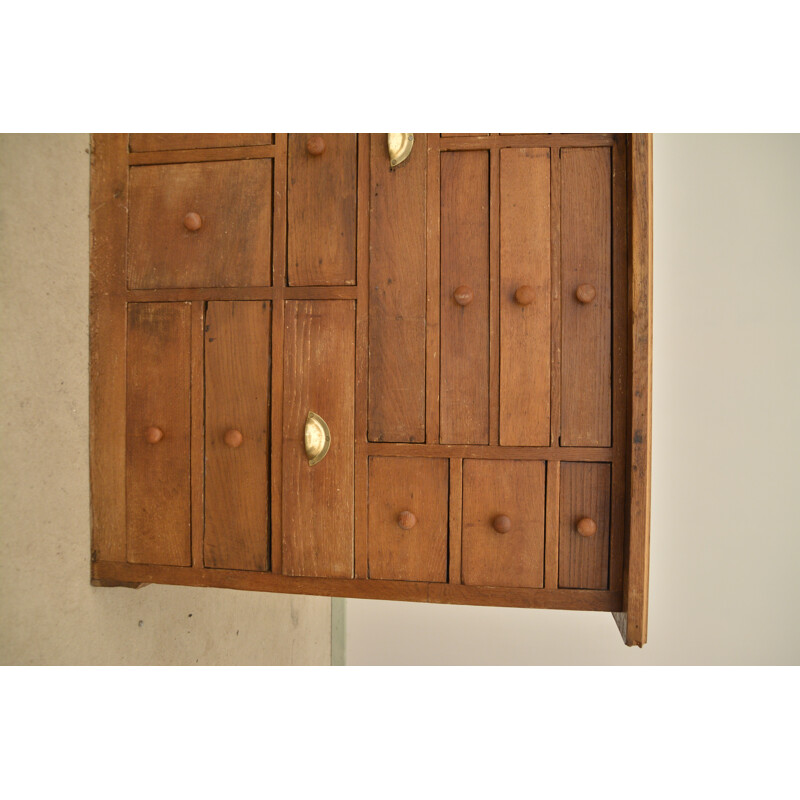 Vintage oakwood craft cabinet with 22 drawers of all sizes and shapes