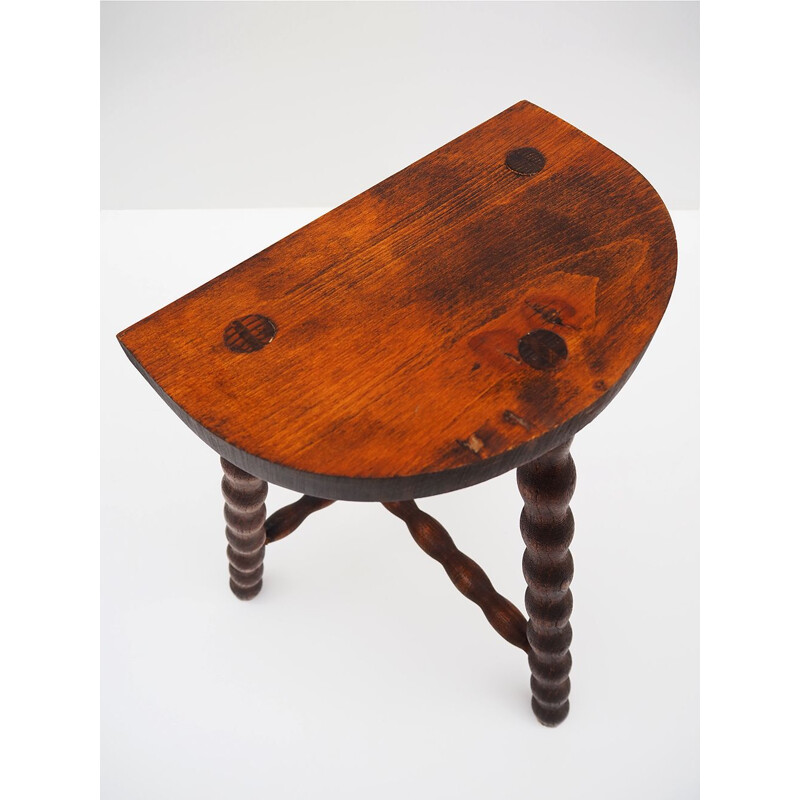 Vintage rustic stool in turned wood