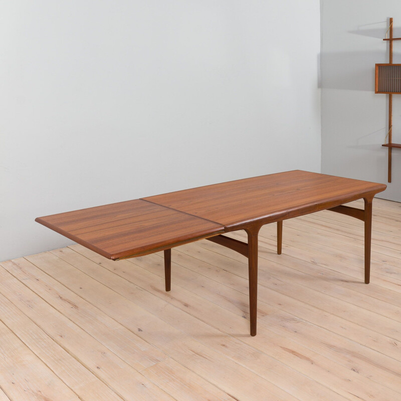 Vintage teak dining table with hidden extension by Johannes Andersen for Uldum, Denmark 1960s