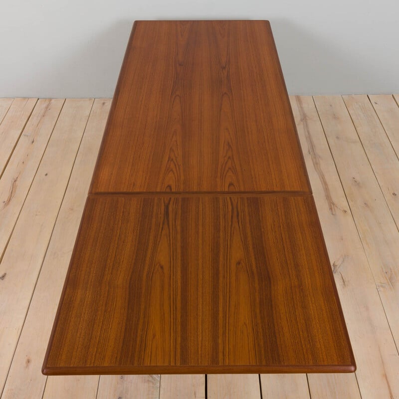 Vintage teak dining table with hidden extension by Johannes Andersen for Uldum, Denmark 1960s