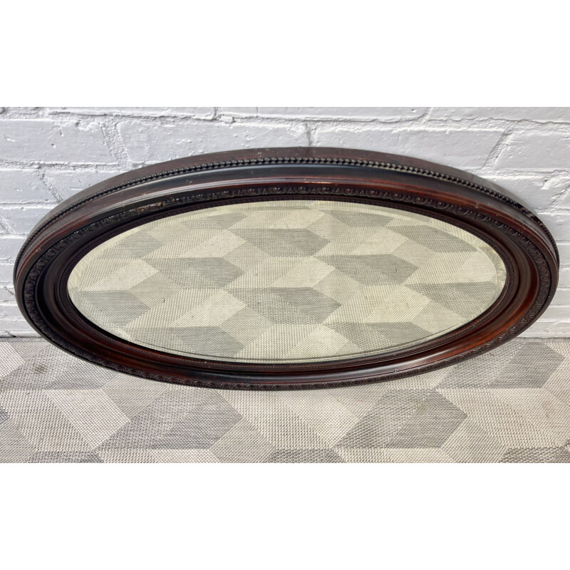 Vintage oval mirror with wooden frame