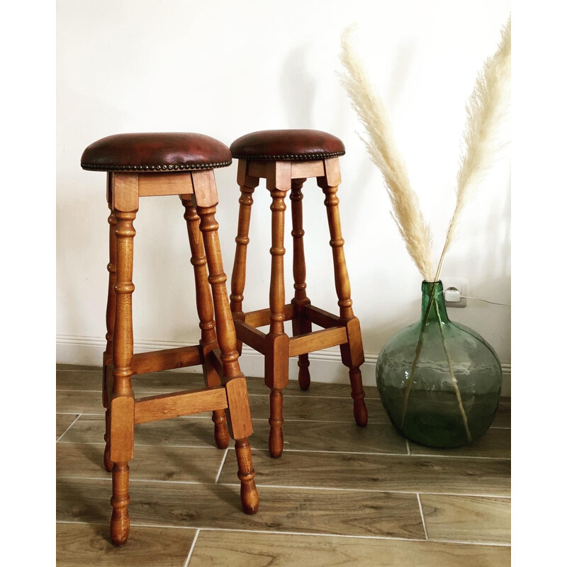 Pair of vintage wood and leatherette bar stools
