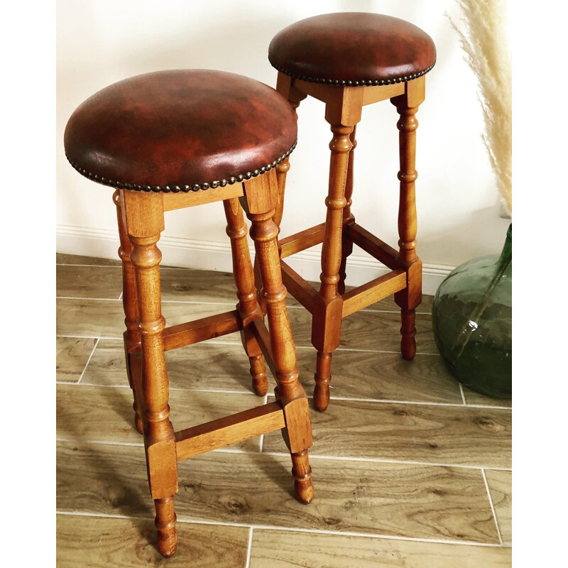 Pair of vintage wood and leatherette bar stools