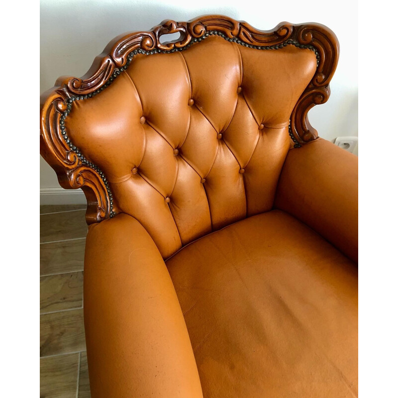 Vintage Chesterfield armchair in leather and carved wood