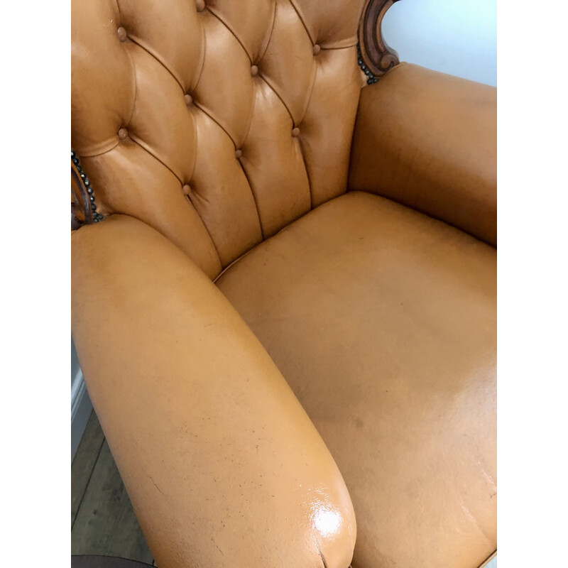 Vintage Chesterfield armchair in leather and carved wood