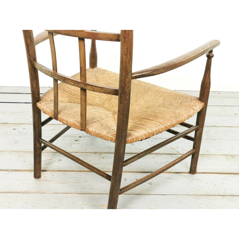 Vintage Arts & Crafts Lattice armchair with rush seat by Liberty & Co