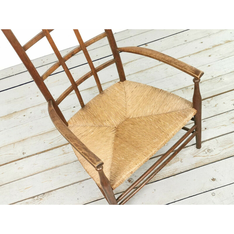 Vintage Arts & Crafts Lattice armchair with rush seat by Liberty & Co