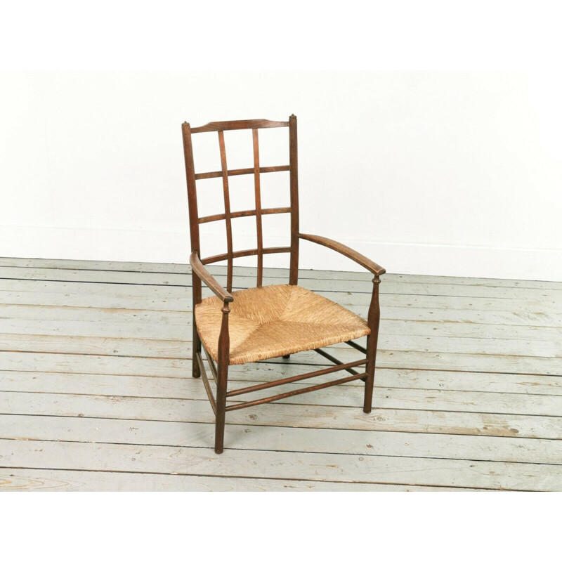 Vintage Arts & Crafts Lattice armchair with rush seat by Liberty & Co