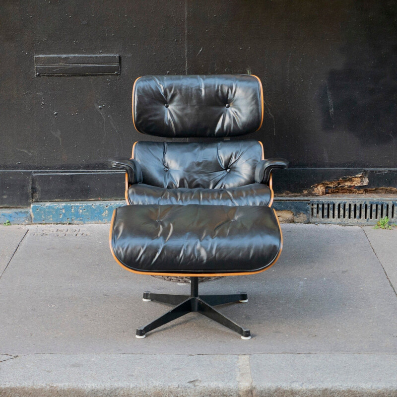 Vintage lounge chair "Chair Noir" with ottoman by Charles & Ray Eames for Vitra