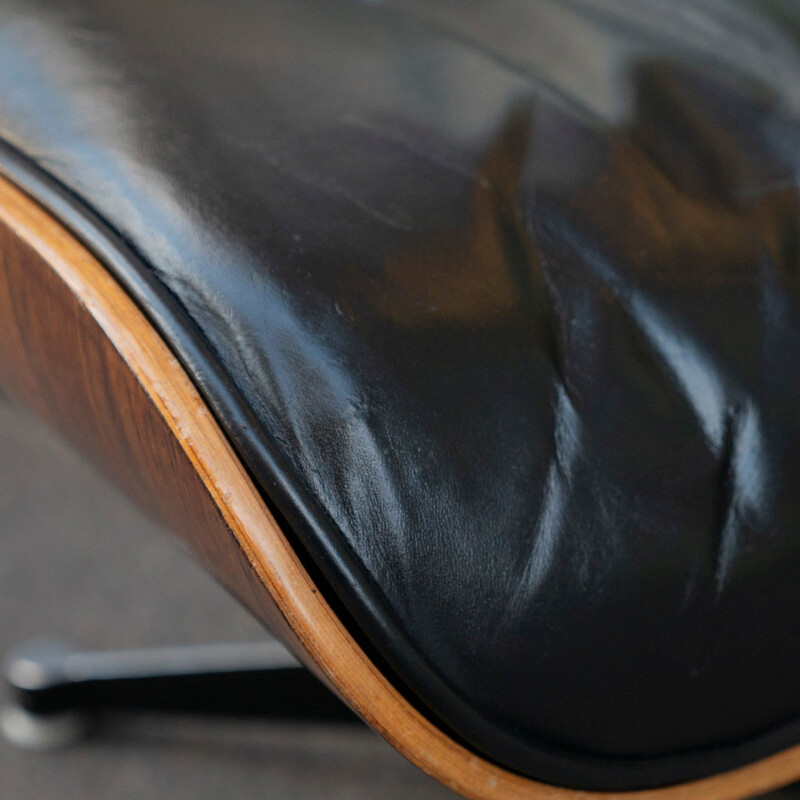 Vintage lounge chair "Chair Noir" with ottoman by Charles & Ray Eames for Vitra