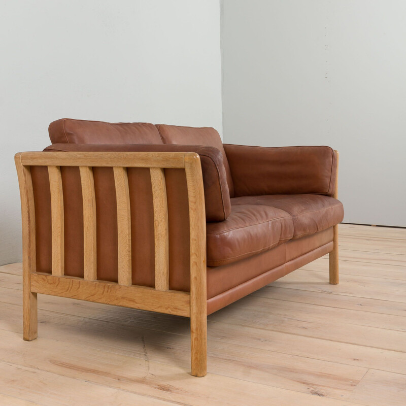 Mid-century two seater Aniline leather sofa with oak frame by Mogens Hansen, Denmark 1970s