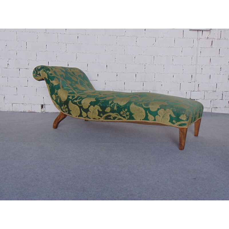 Vintage daybed in green and gold fabric and straw tapestry