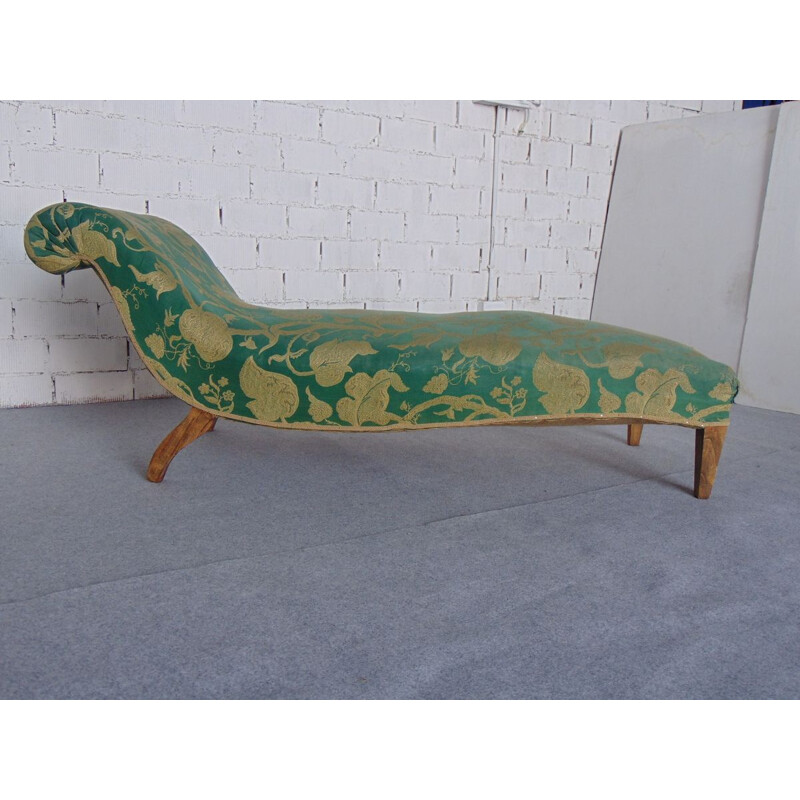 Vintage daybed in green and gold fabric and straw tapestry