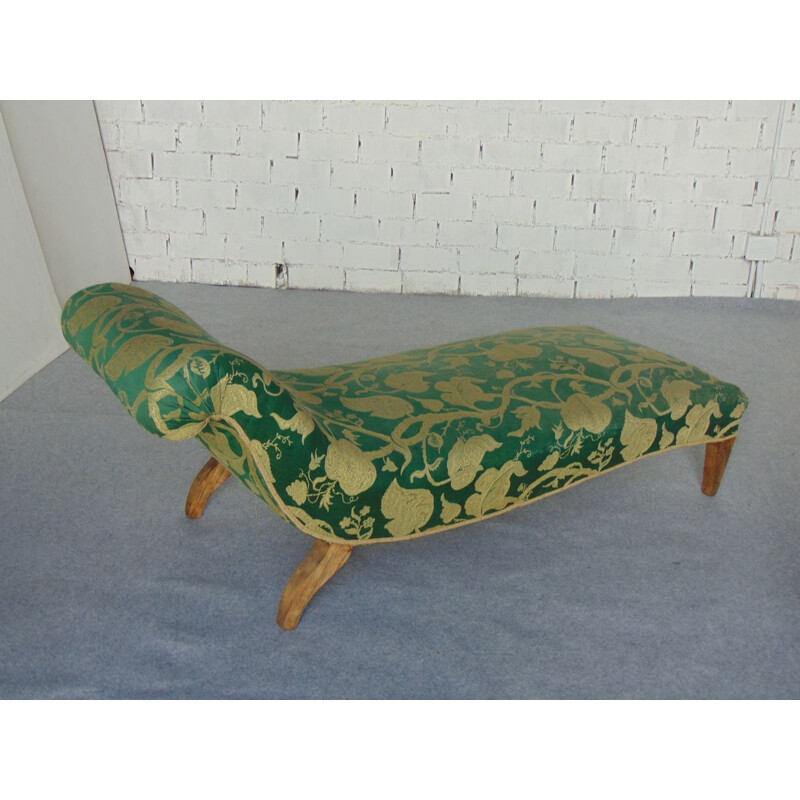 Vintage daybed in green and gold fabric and straw tapestry