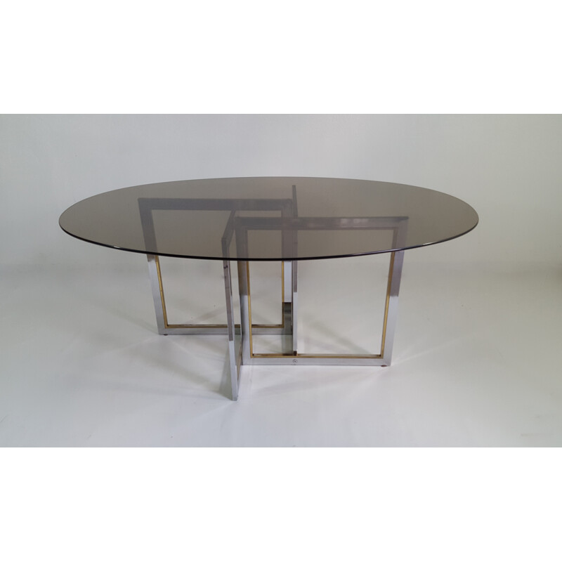 Oval dining table with asymmetrical feet - 1970s