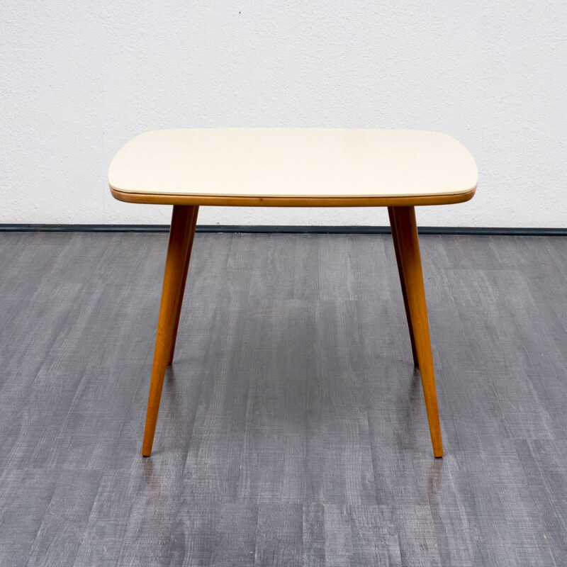 Coffee table with creme-white glass top - 1960s