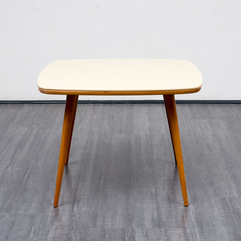 Coffee table with creme-white glass top - 1960s