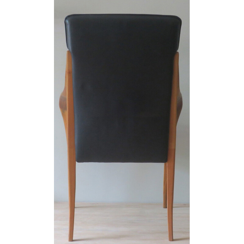 Sillón vintage de cuero negro con brazos curvados