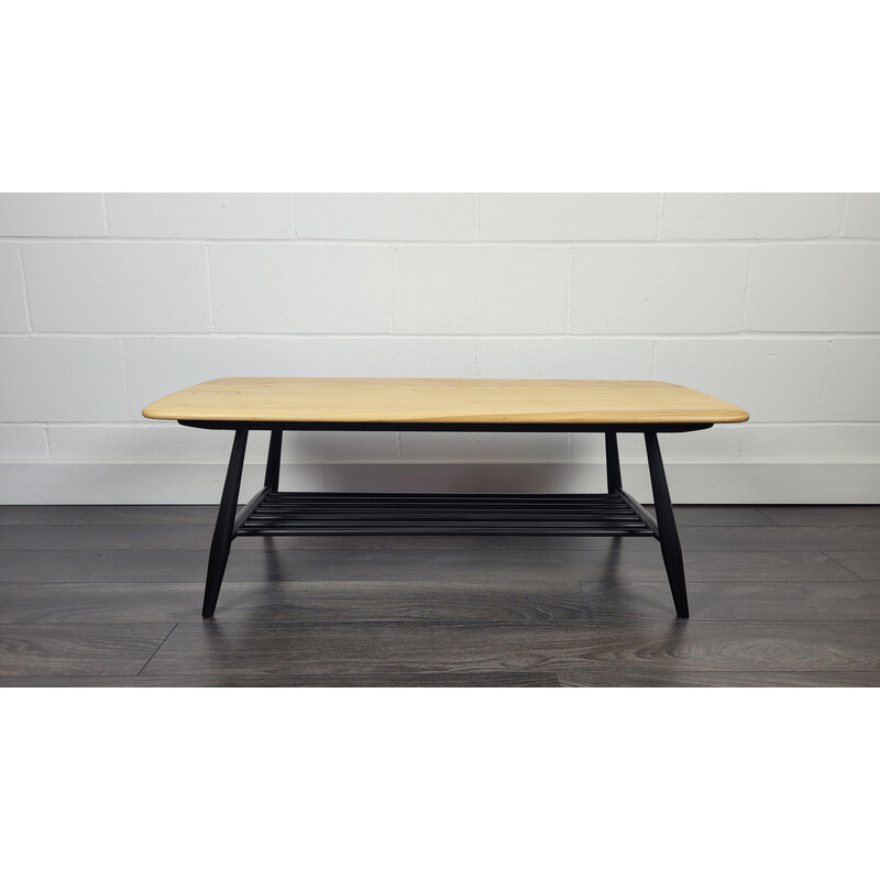 Vintage elmwood coffee table with black legs by Ercol, 1970s