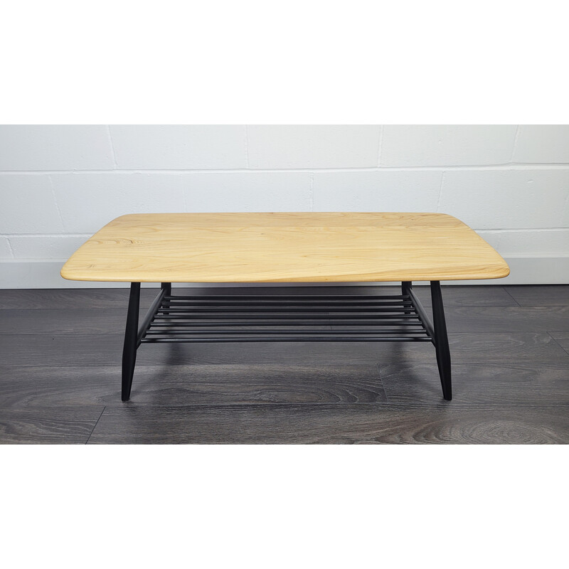Vintage elmwood coffee table with black legs by Ercol, 1970s