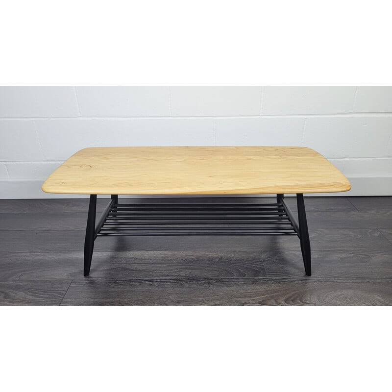 Vintage elmwood coffee table with black legs by Ercol, 1970s