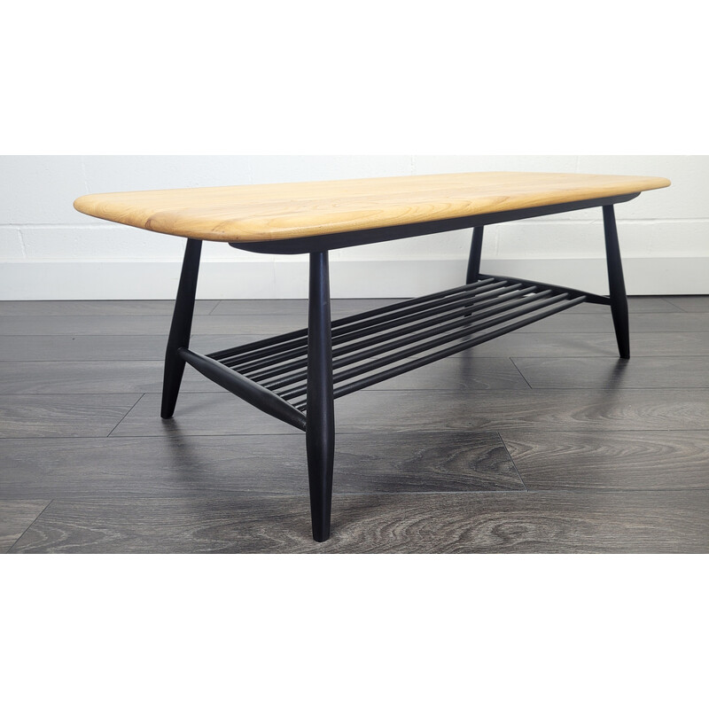 Vintage elmwood coffee table with black legs by Ercol, 1970s