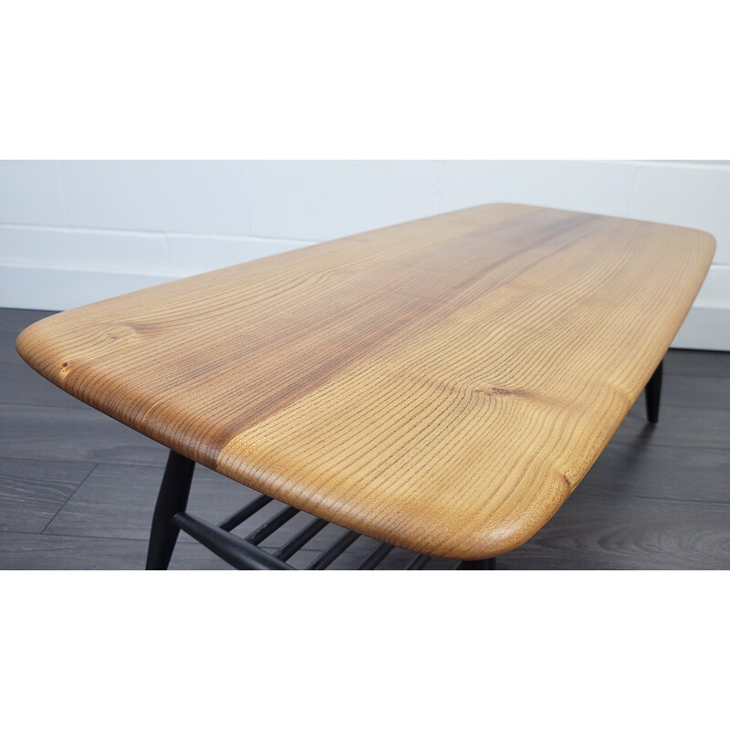 Vintage elmwood coffee table with black legs by Ercol, 1970s