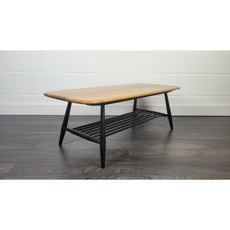 Vintage elmwood coffee table with black legs by Ercol, 1970s