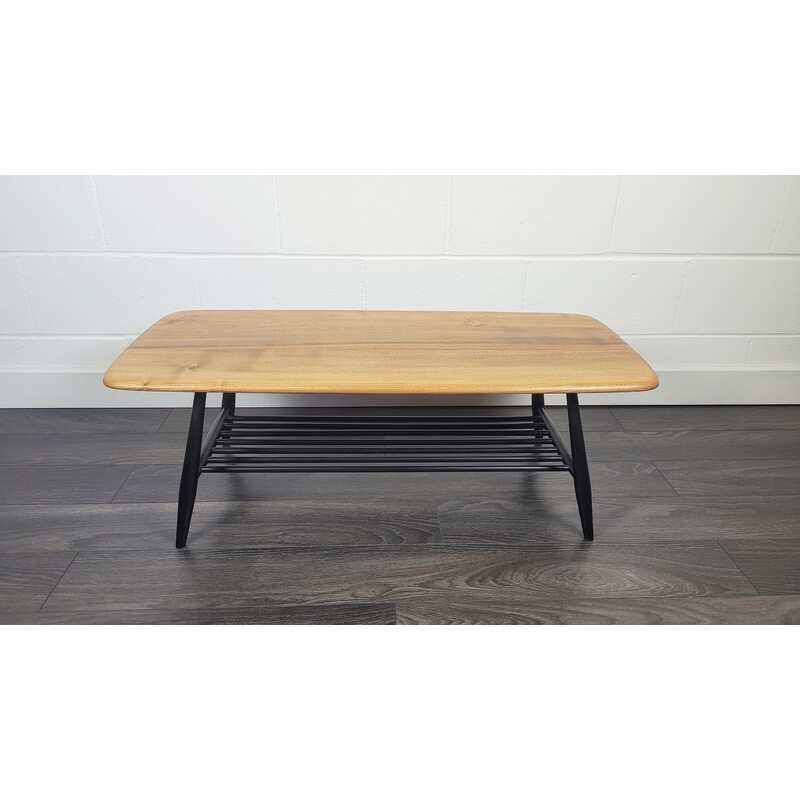 Vintage elmwood coffee table with black legs by Ercol, 1970s