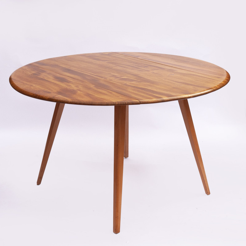 Vintage beechwood and elmwood round dining table by Ercol, UK 1960s