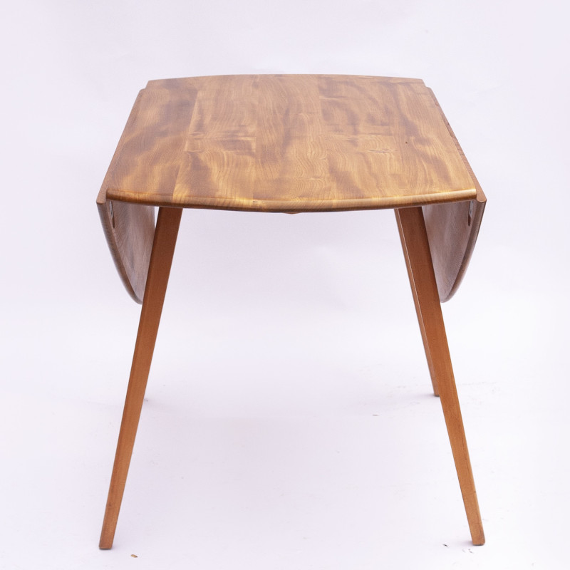 Vintage beechwood and elmwood round dining table by Ercol, UK 1960s