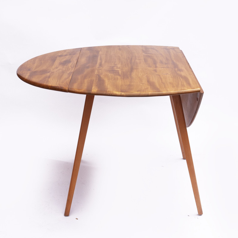 Vintage beechwood and elmwood round dining table by Ercol, UK 1960s