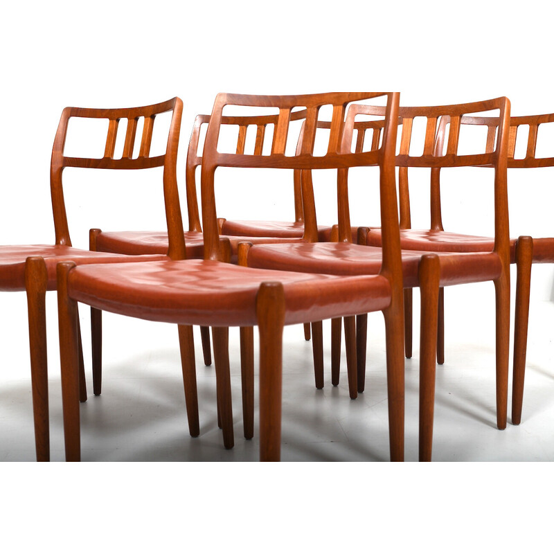 Conjunto de 6 cadeiras de teca vintage e de couro vermelho indiano por Niels O. Møller, 1960