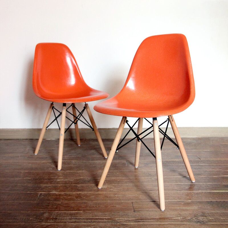 Pair of vintage orange Dsw chairs by Charles and Ray Eames for Herman Miller