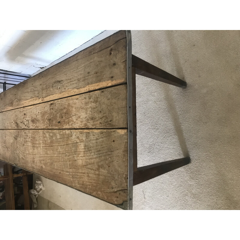 Vintage farm table surrounded by zinc on the sides