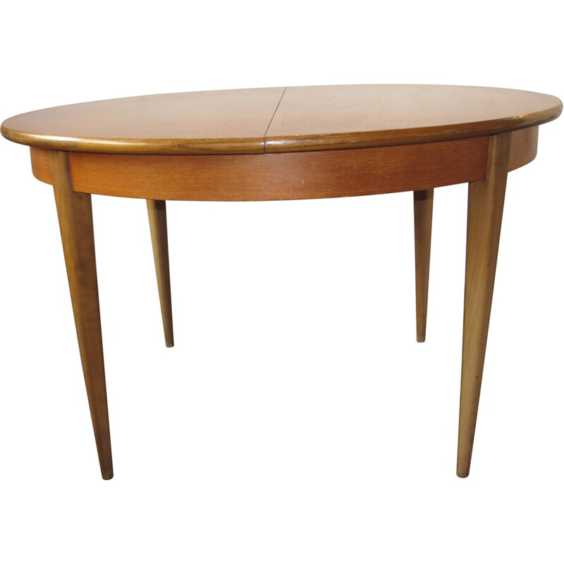 Round extendible dining table in massive wood - 1960s