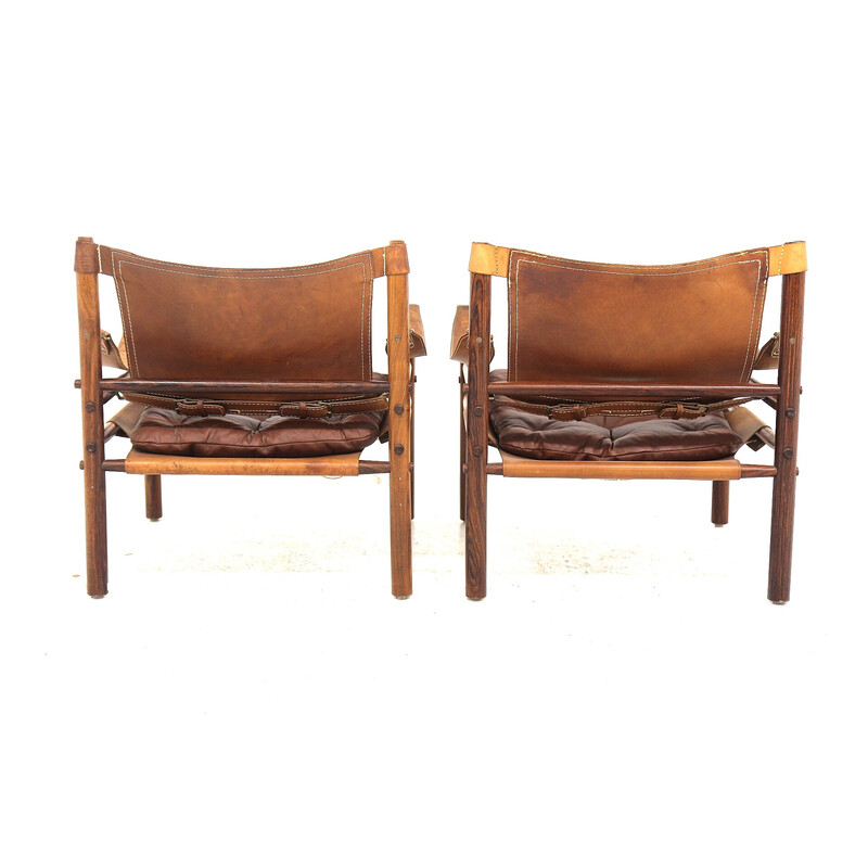 Paar vintage "Sirocco" fauteuils in rozenhout en leer van Arne Norell, Zweden 1960