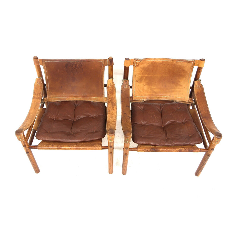 Paar vintage "Sirocco" fauteuils in rozenhout en leer van Arne Norell, Zweden 1960