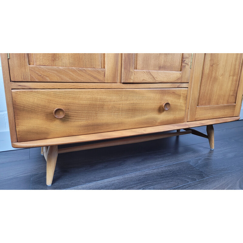 Vintage solid English elm sideboard with flared leg by Ercol, England 1960