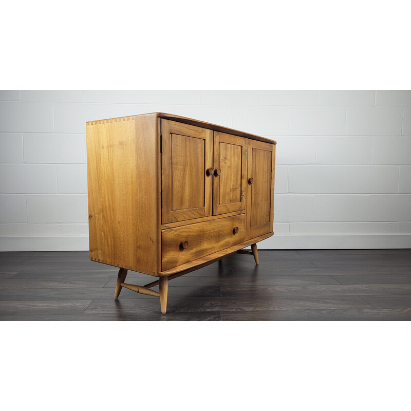 Vintage solid English elm sideboard with flared leg by Ercol, England 1960