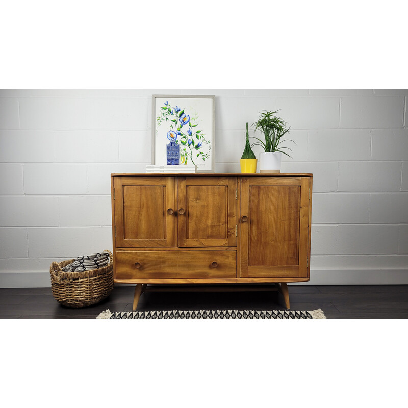 Vintage solid English elm sideboard with flared leg by Ercol, England 1960